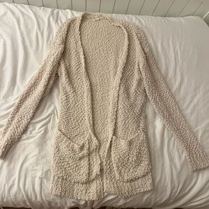 A medium cream fluffy knit cardigan from Newbury Kustom